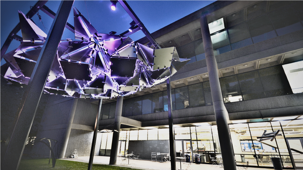Artistic sculpture suspended outside the design building.