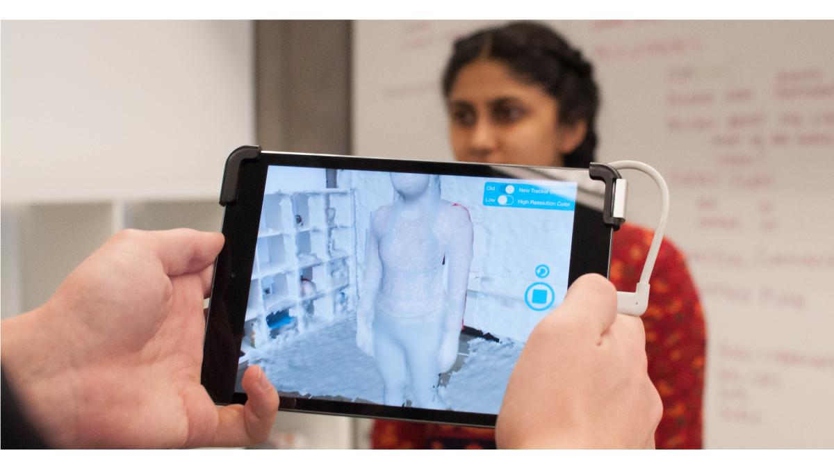 Student being scanned with iPad.