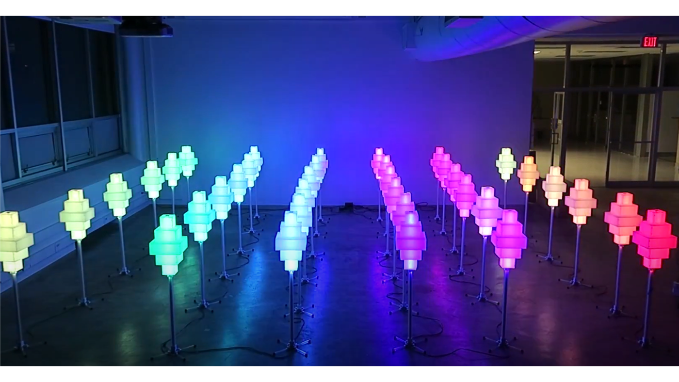 Rows of colorful lamps that change color based on human interaction.