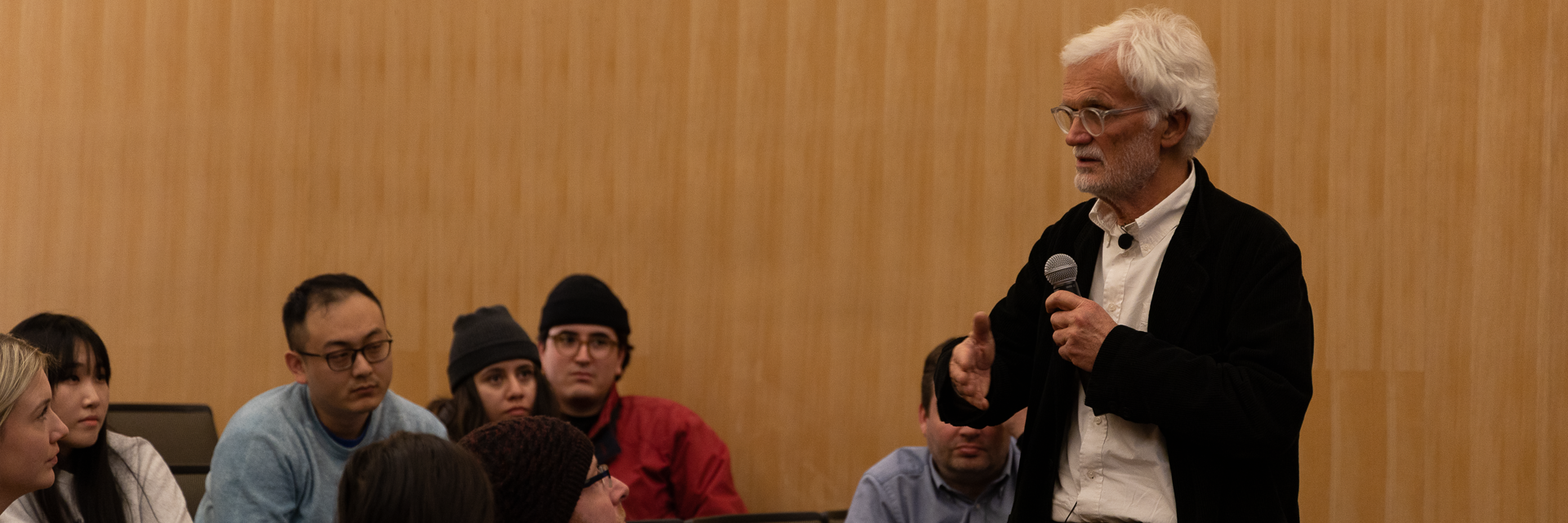 Ezio Manzini speaking to students in an auditorium