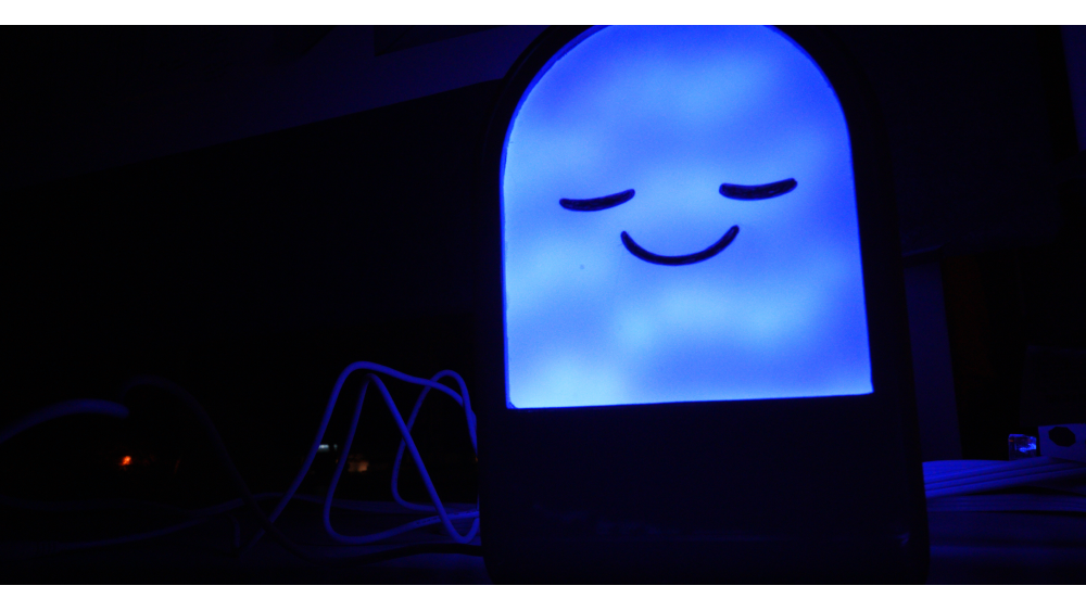 student lighting project, blue light with smiley face