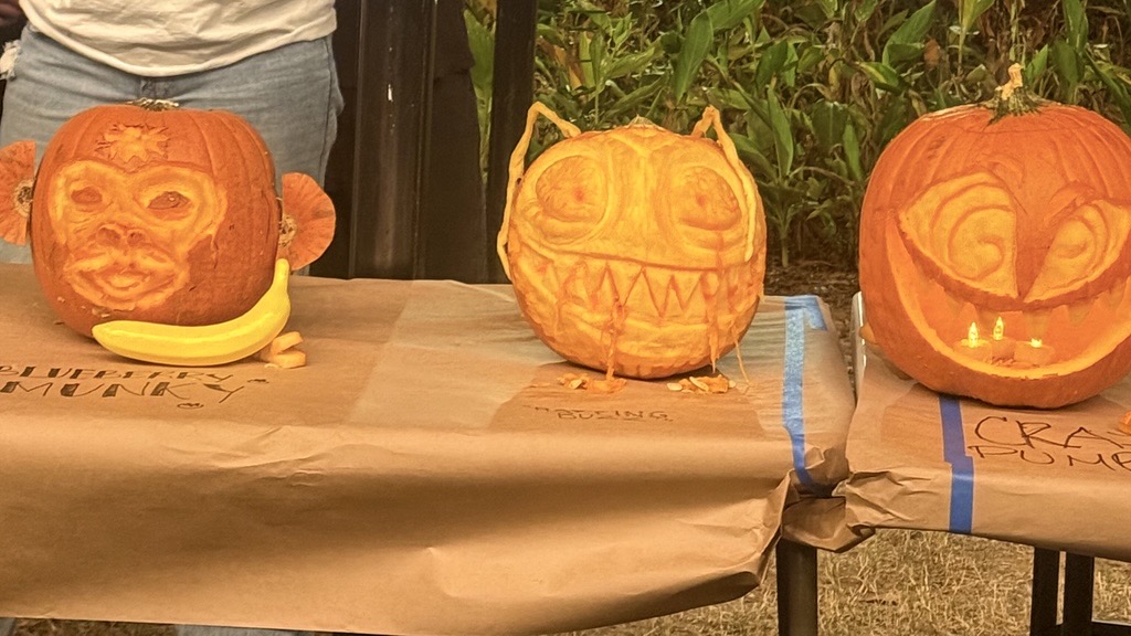 Monkey and buzz monkey pumpkin designs pictured together 