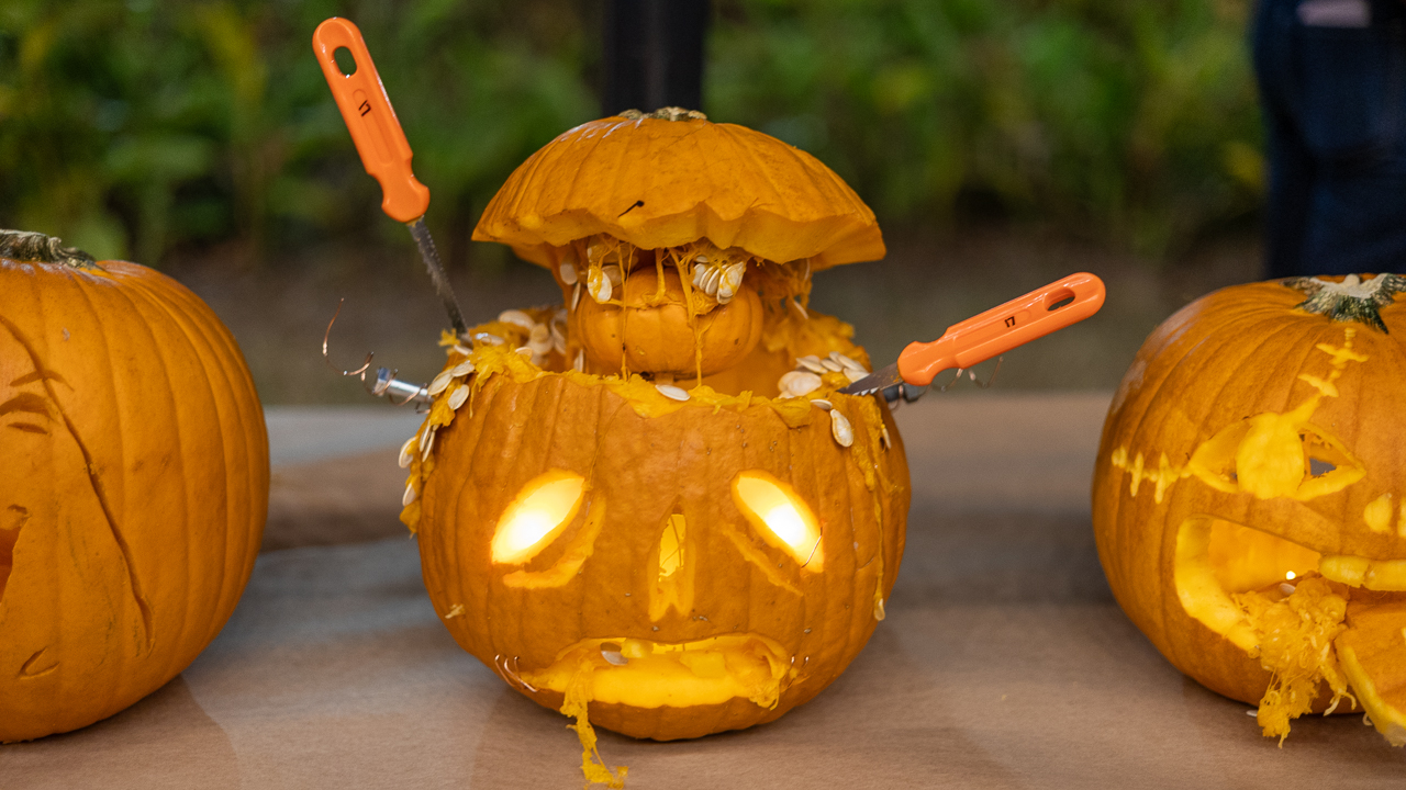 Finalized Frankenstein pumpkin has bolts and tools sticking out of it